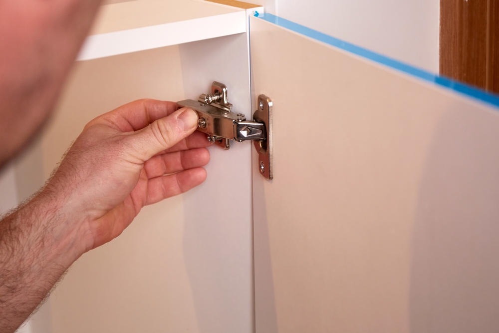 The Hair Tie Hack That Fixes a Loose, Wobbly Cabinet Door